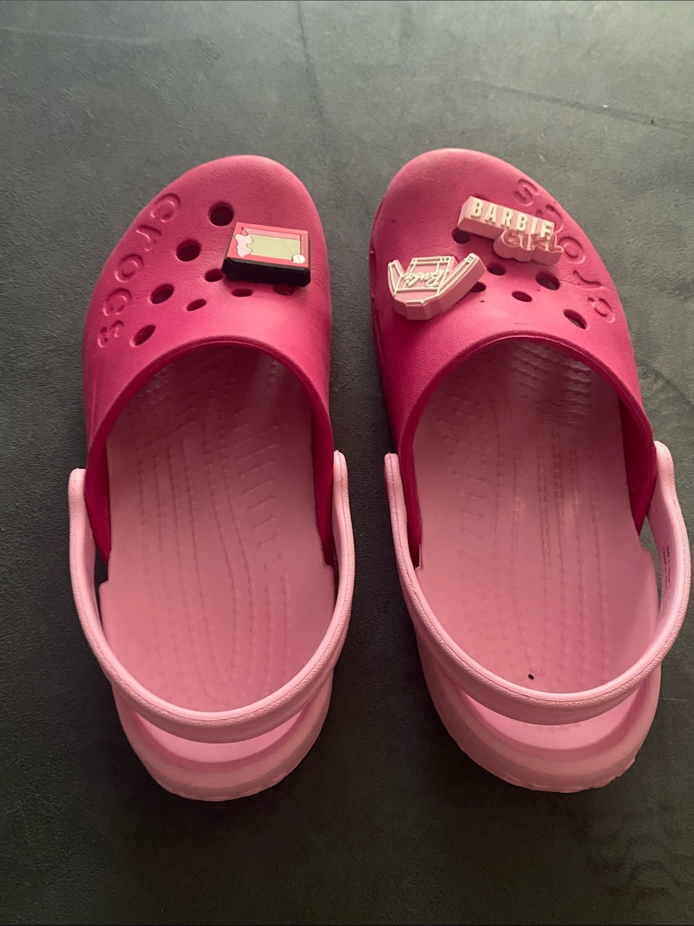 Pink 2 tone Crocs w/ Barbie Charms. Size J1 (big kids 1). Really good condition.